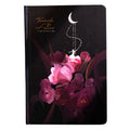 A5 notebook with luminous cover open to show pages with colour illustrations