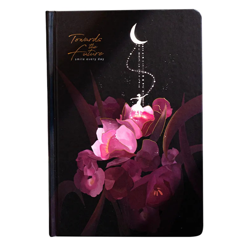 A5 notebook with luminous cover open to show pages with colour illustrations