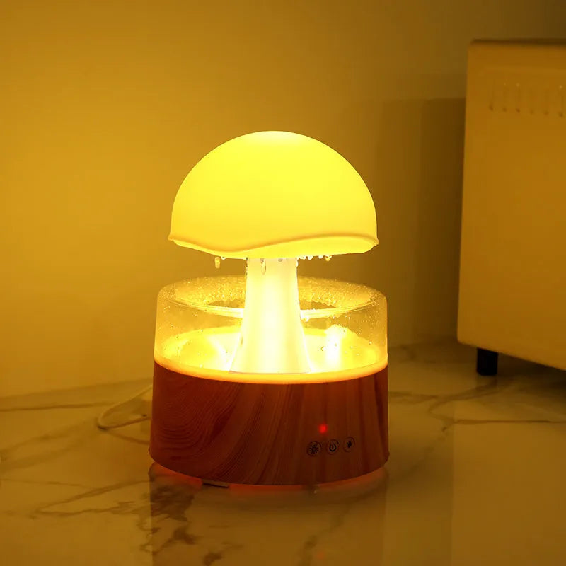 White cloud-shaped humidifier with falling water droplets and coloured night light