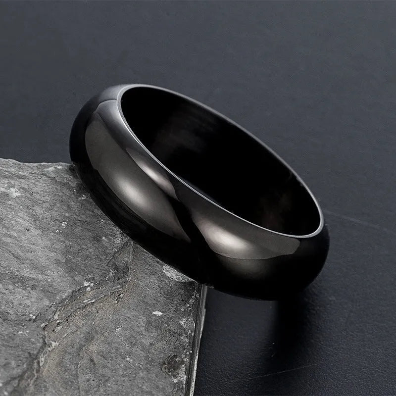Glossy electroplated titanium steel ring shown in gold, black, and steel colour on a size chart from 7 to 12.