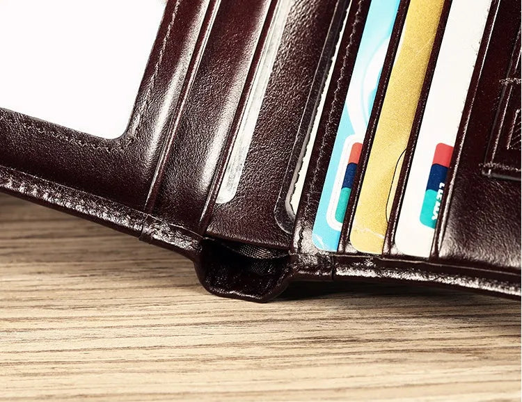 Men's leather wallet showing multiple compartments including card slots and change pocket
