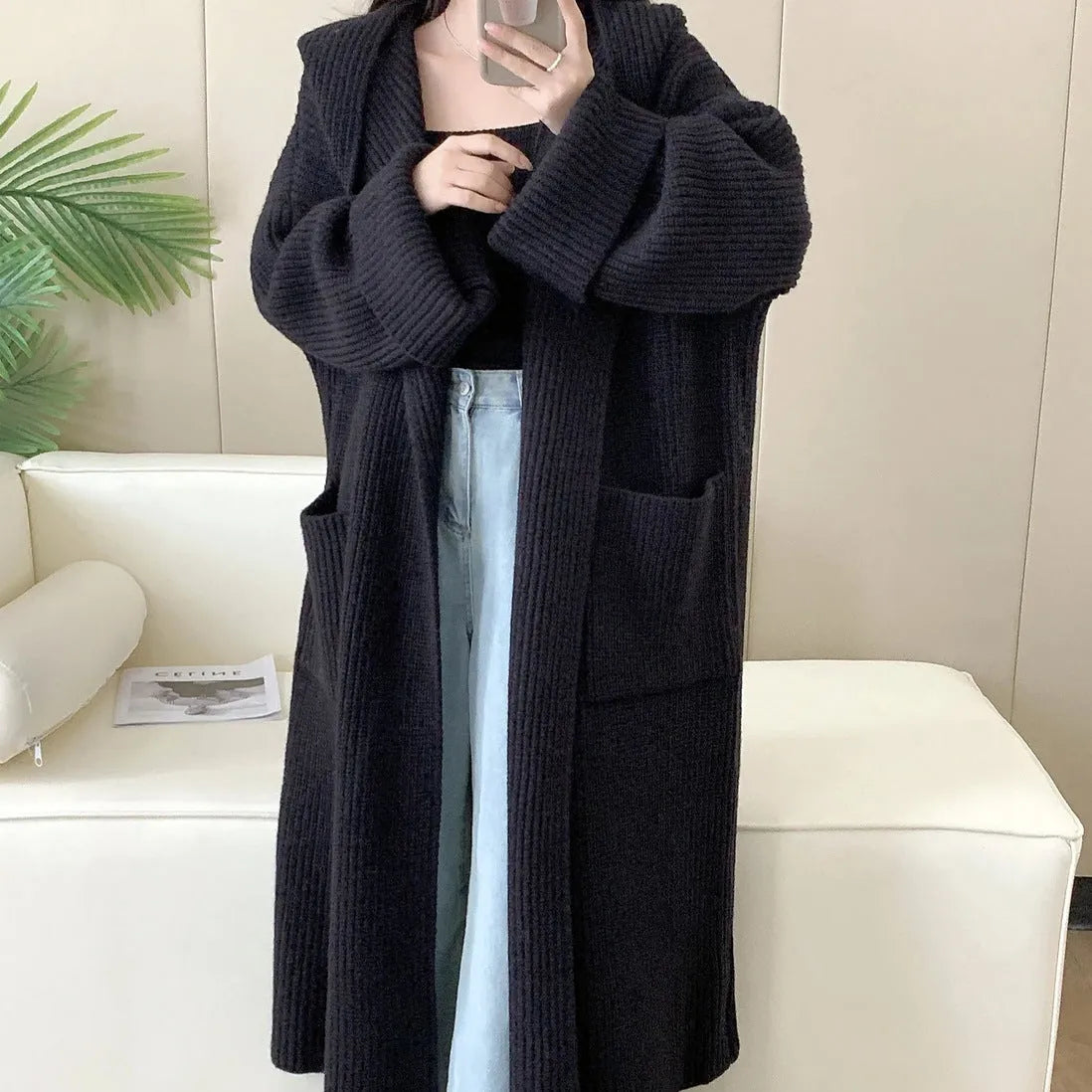 Loose hooded acrylic cardigan coat with extended length and raglan sleeves