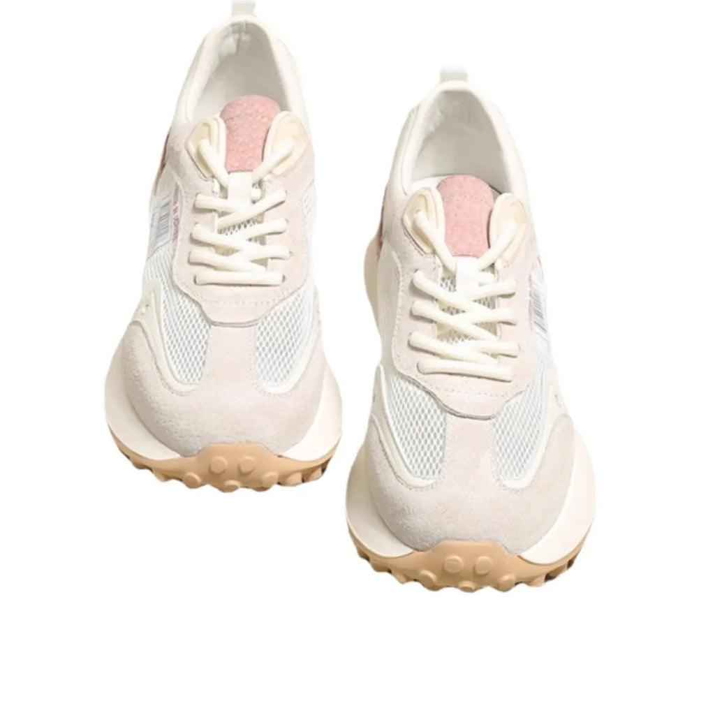 Women's grey retro low-top sneaker with round toe and flat rubber sole on a neutral background.