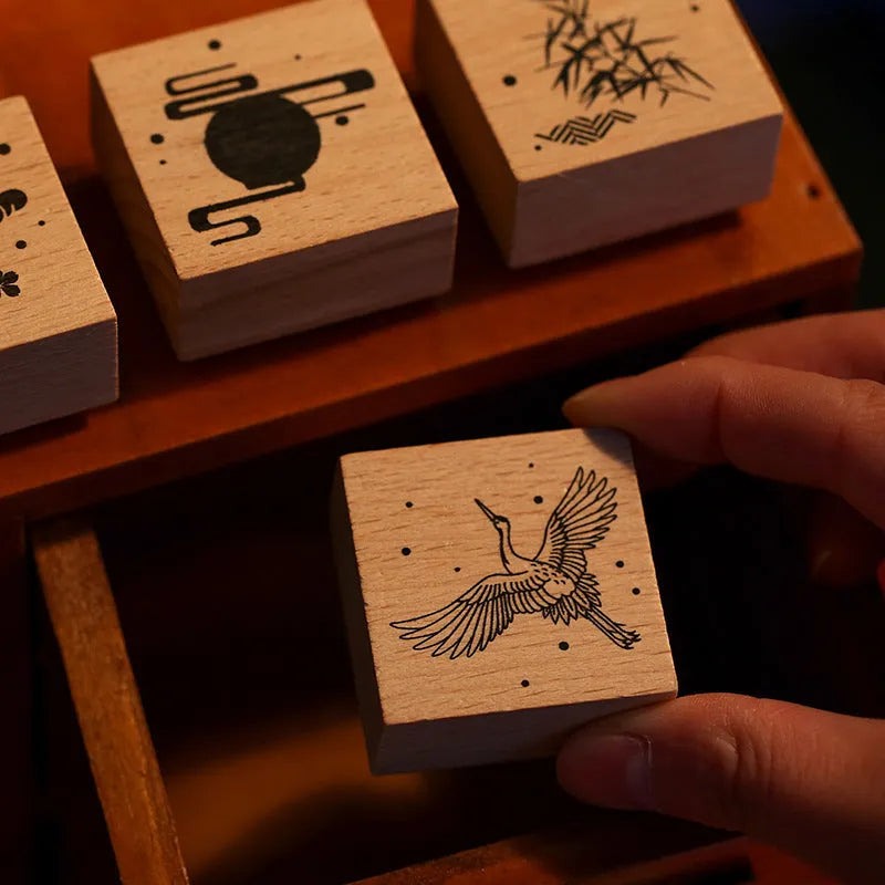 Mr. Paper wooden stamp set with four crane designs on a white background