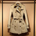 Khaki women's double-breasted polyester trench coat with flight sleeves.