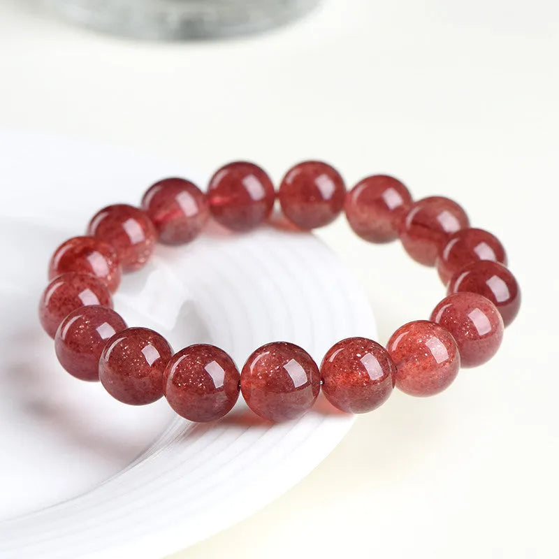 Natural strawberry quartz bracelet with geometric beads in starlight cherry red colour showing three bead size options