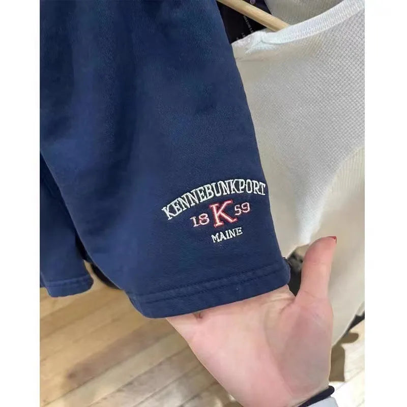 Women's dark blue cotton sports shorts with white flag embroidery, mid-thigh length athletic wear