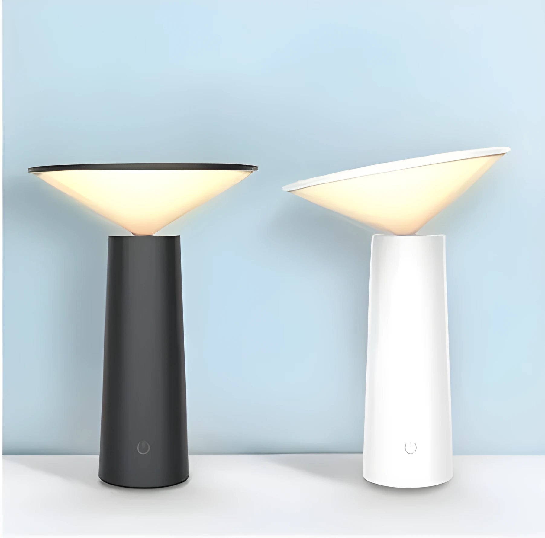 Black or white USB rechargeable LED desk lamp with touch sensor and adjustable head on a desk.