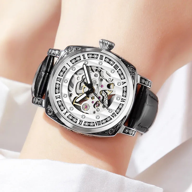 Mechanical wristwatch with luminous hands on a leather strap, shown in multiple colour variants.