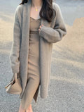 Women's mid-length V-neck knitted cardigan in loose fit with long sleeves