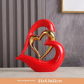 White porcelain love heart ornament in modern geometric style with 1939 Black Gold colour finish on shelf