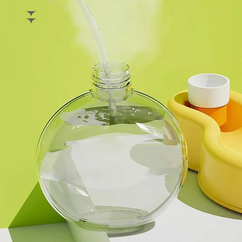Green portable pet travel water cup with drinking bowl extended, showing 2-in-1 design for dogs