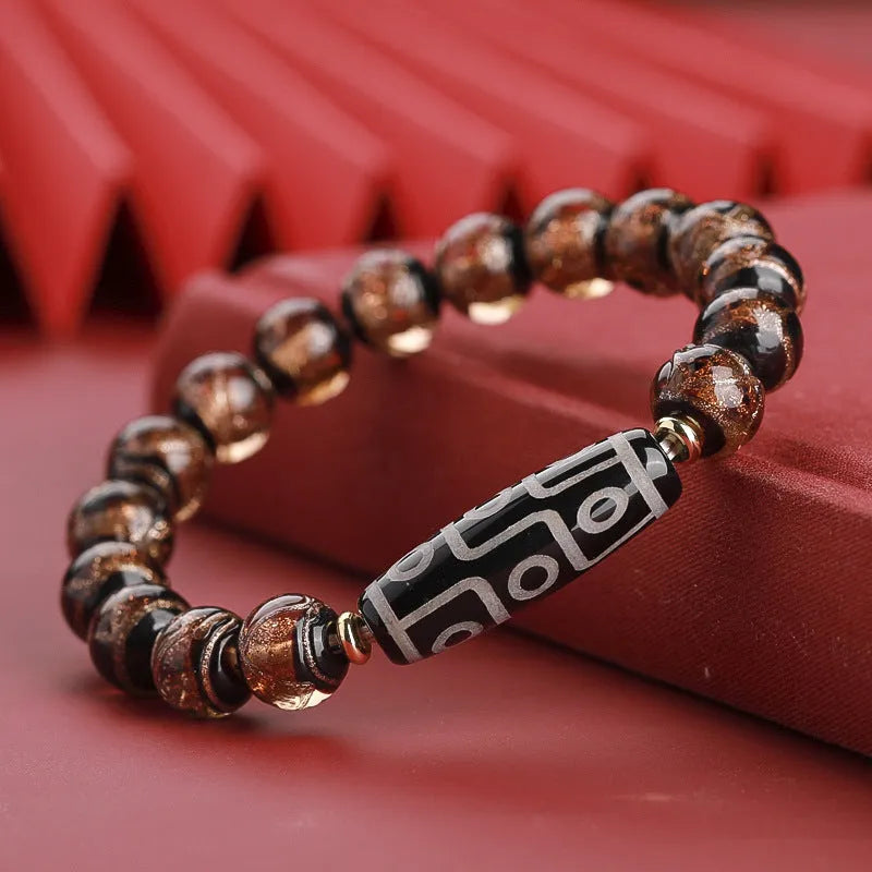 Snake year lucky bracelet with multicoloured glazed beads in Chinese auspicious patterns.