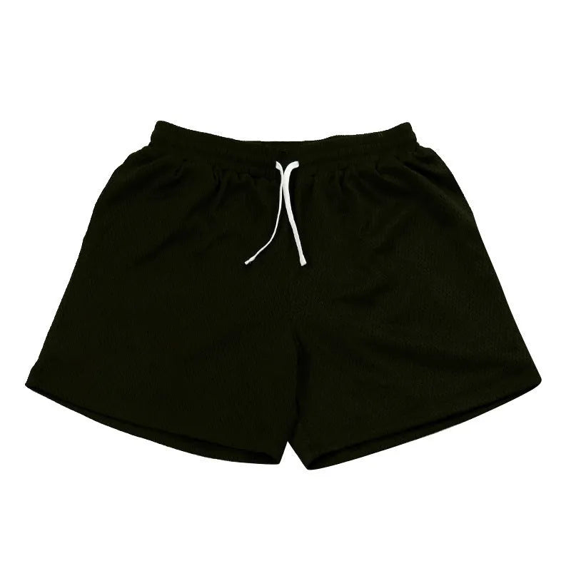 Man's black mesh quick-drying athletic shorts for summer running and fitness.