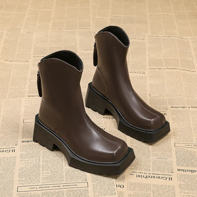 Black square toe women's platform Martin boots with a high heel and back zipper.