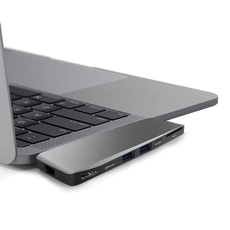 8-in-1 USB-C expansion hub for MacBook Pro with dual plugs, USB ports, card readers, and SSD slot