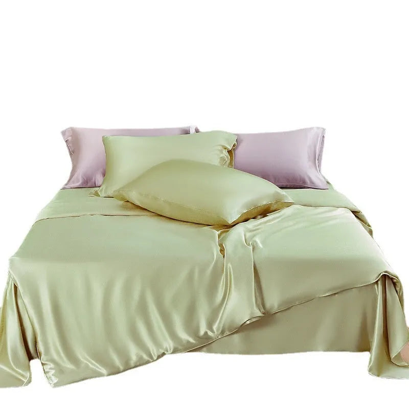 Double-sided solid colour silk duvet cover shown in Lotus Pink, pea green, bright brown, purple, white, or blue.
