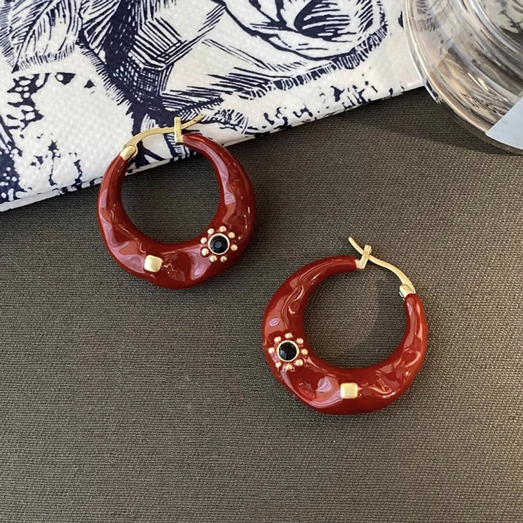 Hong Kong style retro ear studs with dripping oil finish and rhinestone accents in black and red colours
