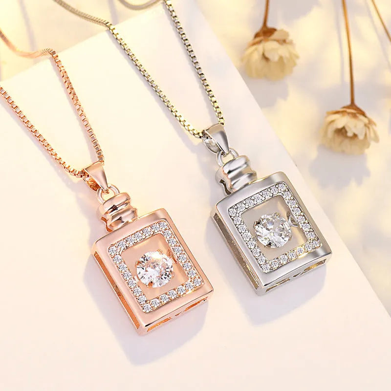 Sterling silver heart necklace with crown and bow detailing pendant in rose gold or silver finish