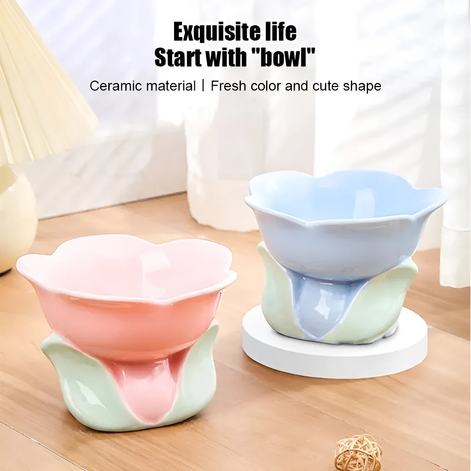 Blue ceramic pet bowl with floral pattern, raised on a non-slip base for cat or small dog feeding.