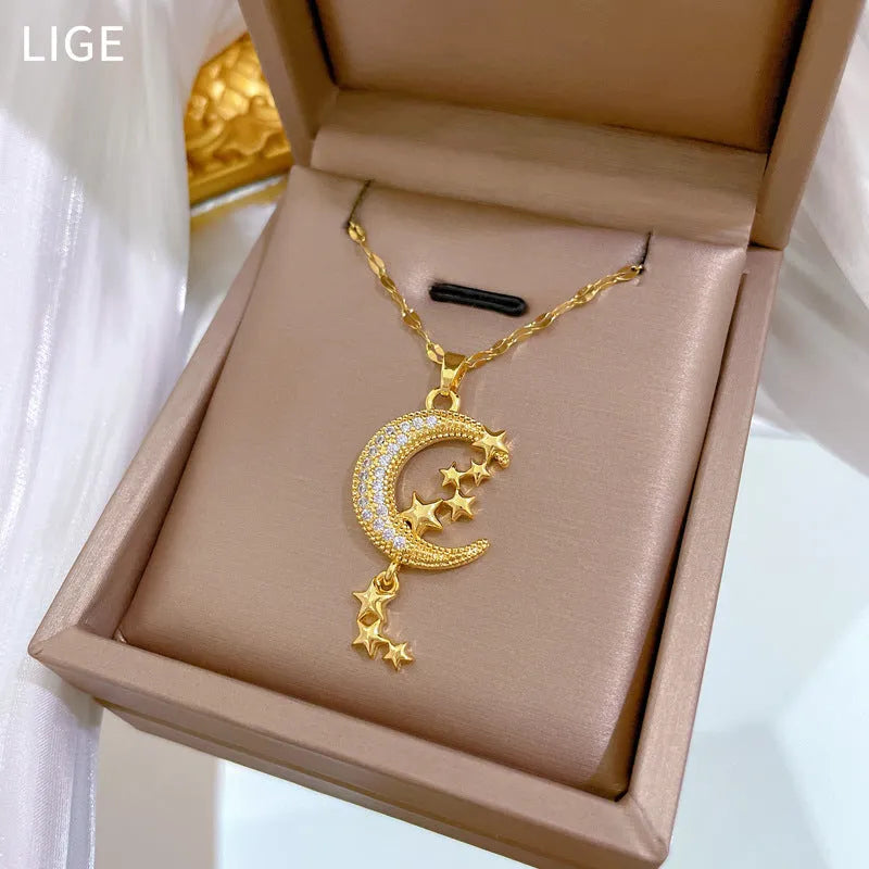 Moon pendant necklace with geometric tassel design and diamond embellishment on stainless steel chain