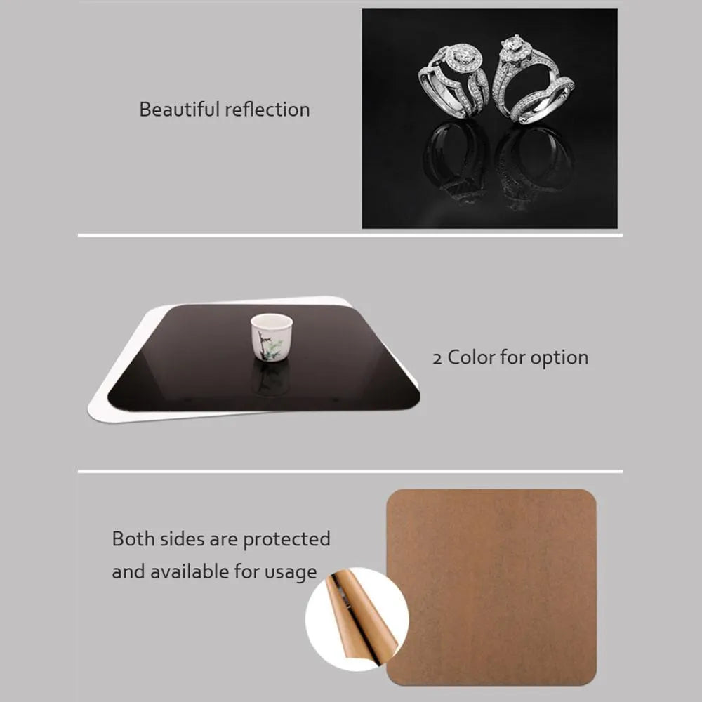 Acrylic photography reflection board in black, 30x30cm, with protective film partially peeled back