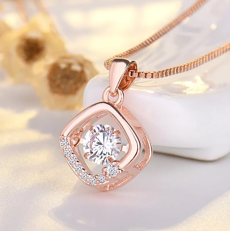 Sterling silver heart necklace with crown and bow detailing pendant in rose gold or silver finish