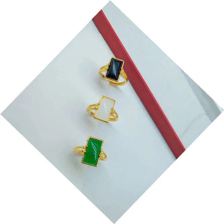 Adjustable brass ring with gold-plated finish and electroplated gemstone inlay