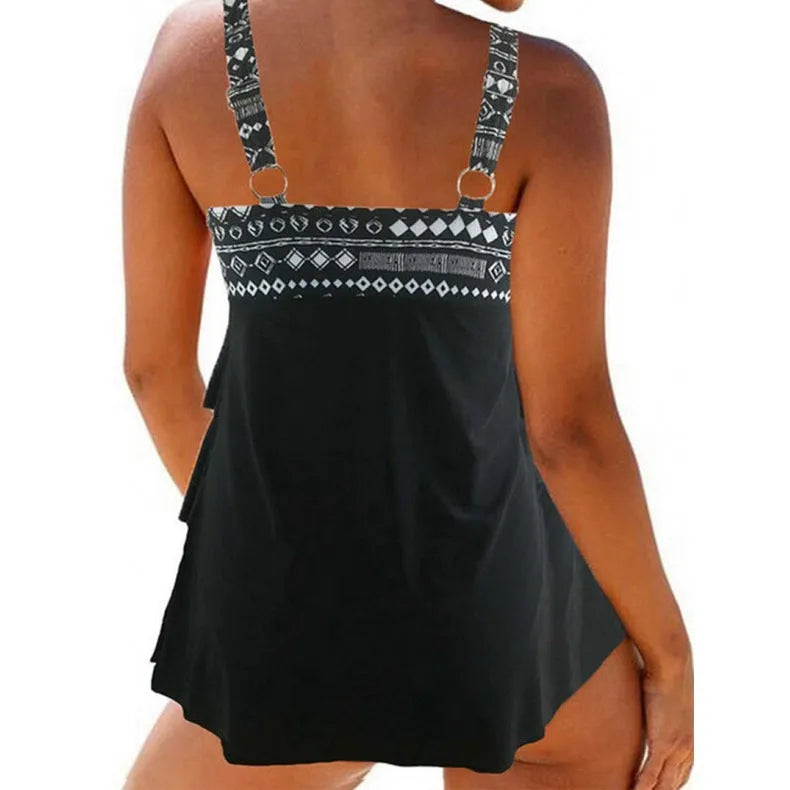 A plus-size women's split swimsuit with double shoulder straps and a bow detail, shown in the picture colour.