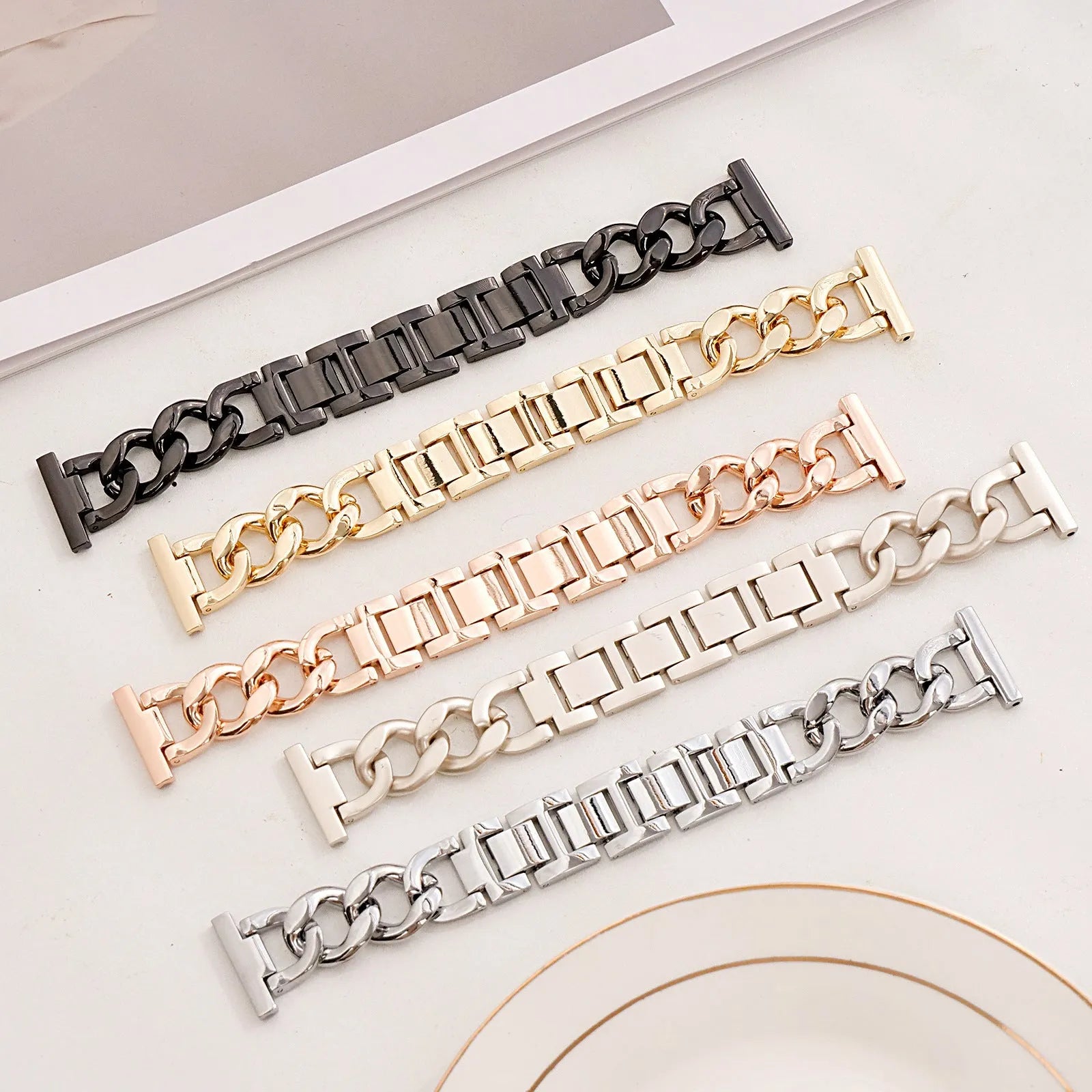 Metal chain link watch strap for Apple Watch in silver, black, gold, rose gold, or Starlight colour.