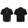 Men's black loose fit polo shirt with square collar and embroidery sequins detail on chest