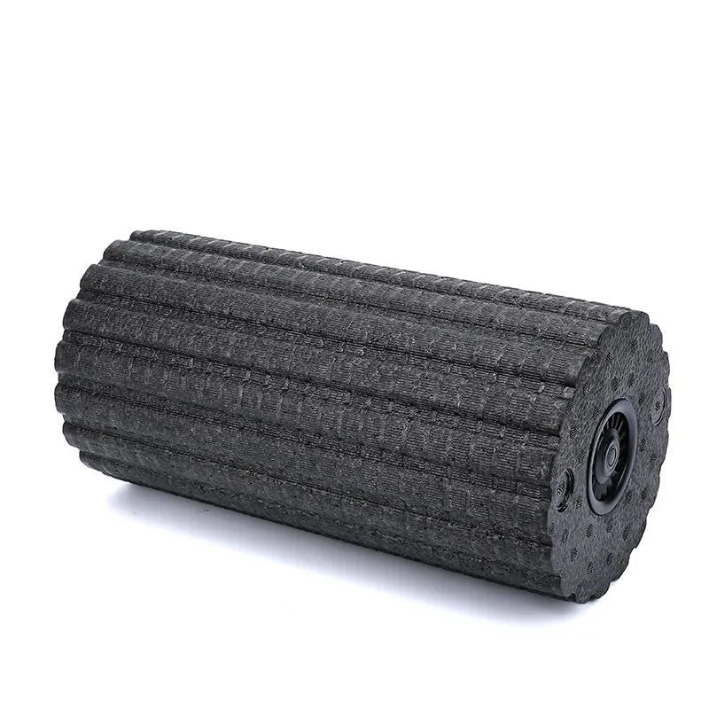 Black 4 speed vibrating massage roller foam on a floor for muscle recovery use