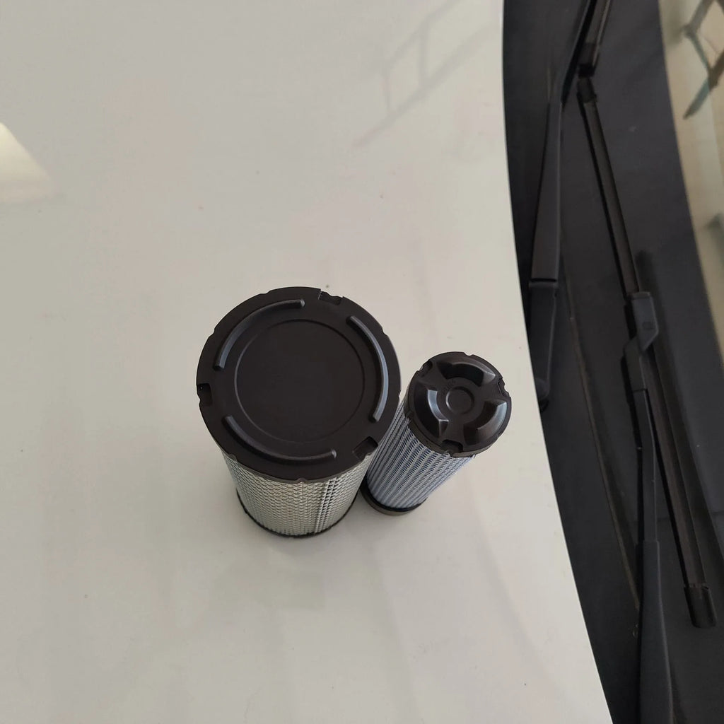 Donaldson 1027 model air filter with straight head and elbow connection, showing folded filter element.