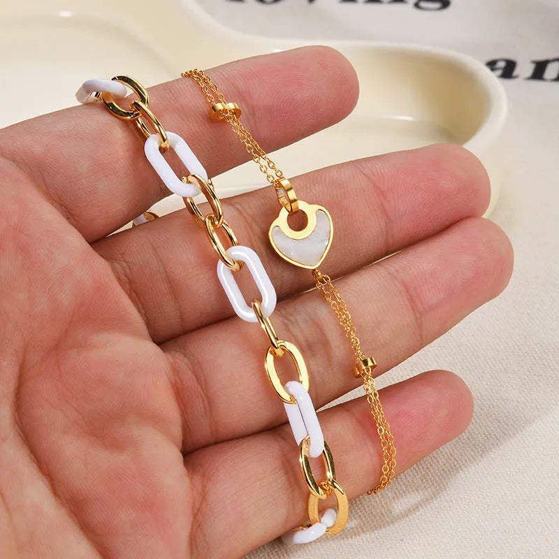 Women's stainless steel bracelet with resin heart charm and double-layer love design