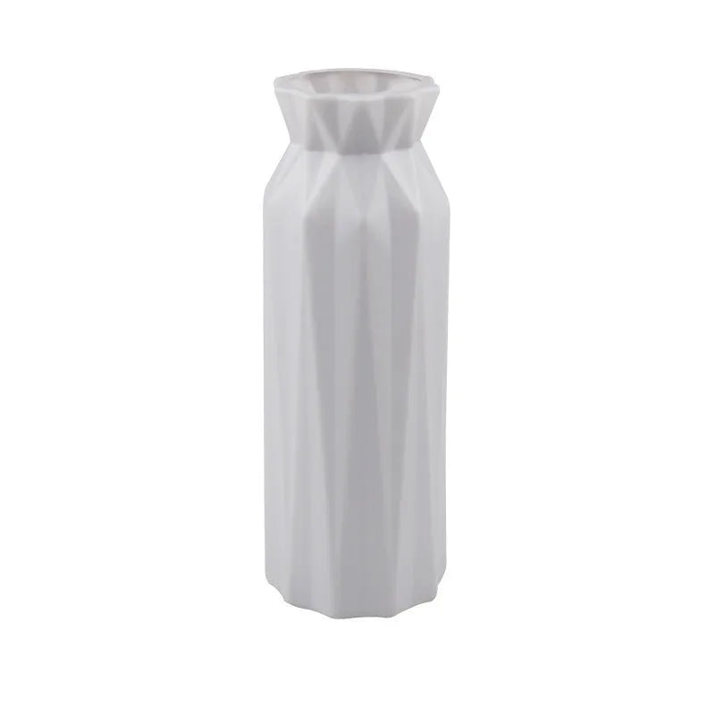 Grey melamine plastic vase with a wide 7.2cm base on a wooden table.