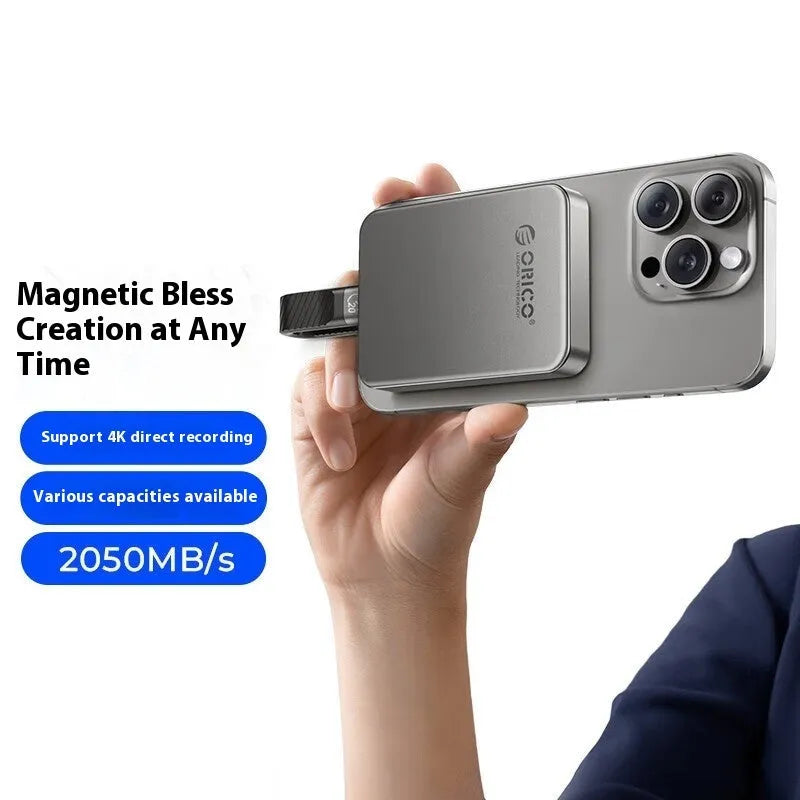 Grey alloy plastic magnetic mobile SSD external hard drive with C to C cable and magnetic ring.