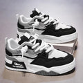 Men's white low-top board shoes with colour-matching accents on a soft rubber sole.