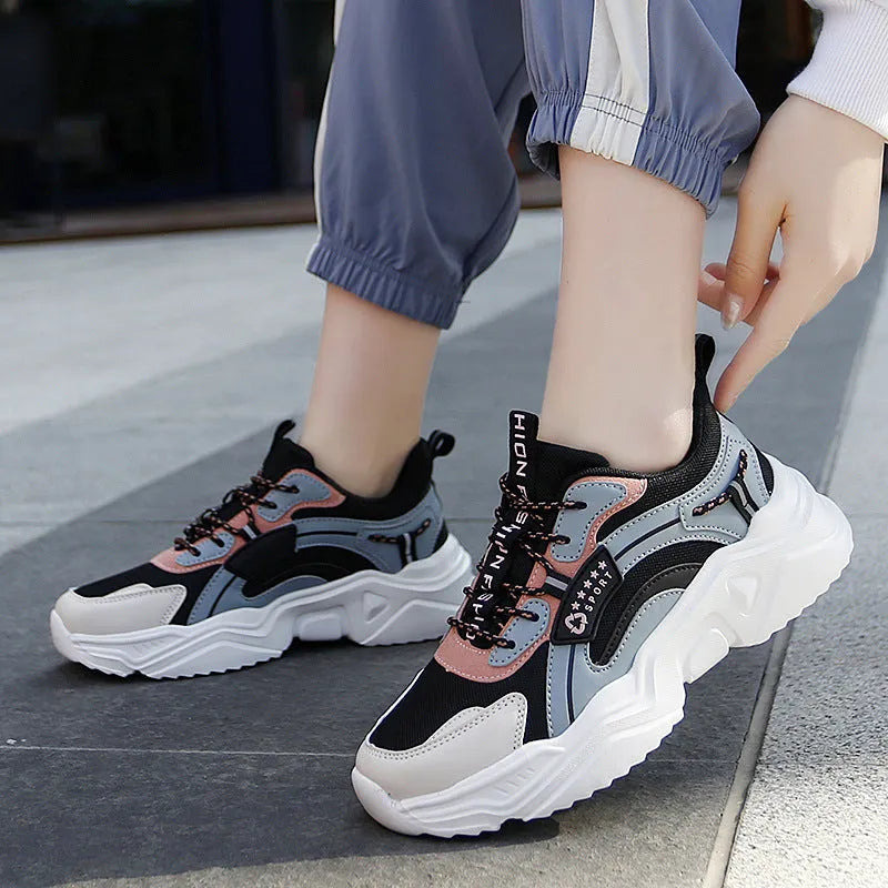 Women's white and black casual mesh sports shoes with a thick PU sole and buckle.