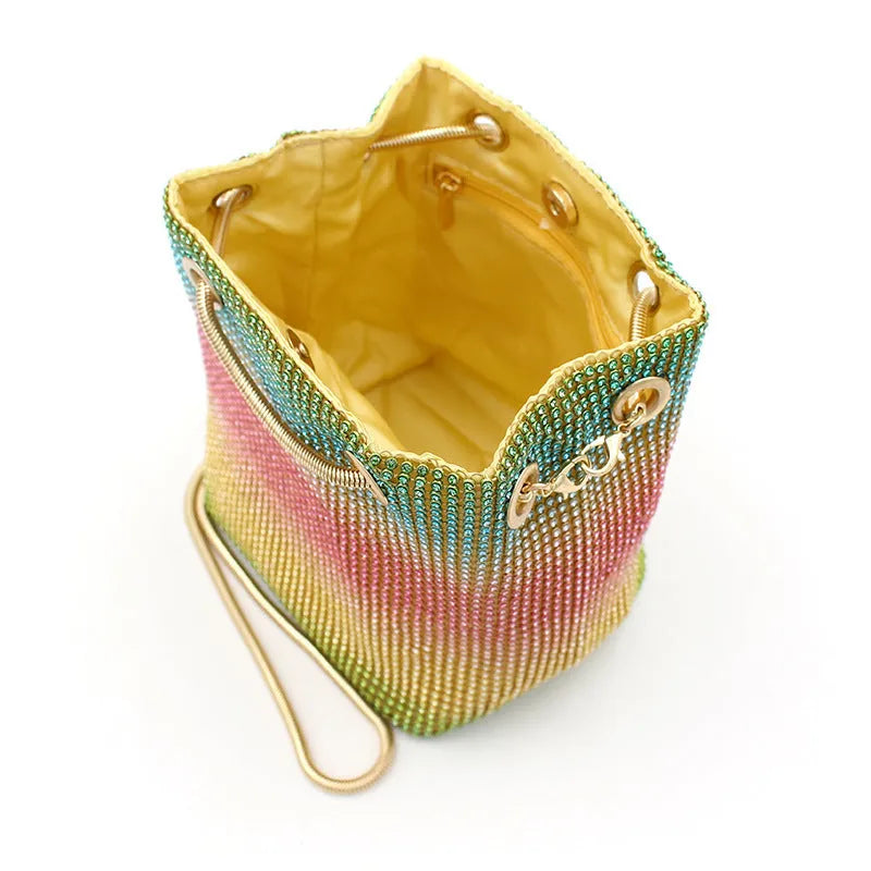 Soft rhinestone bucket handbag with diamond stud detailing in rainbow colour variations