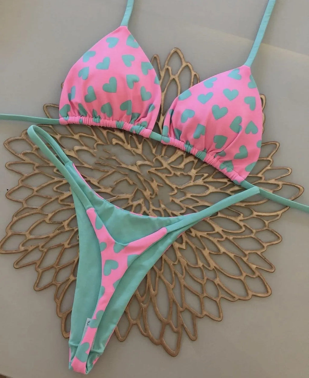 Women's backless split swimsuit with heart printing in nylon and cotton.