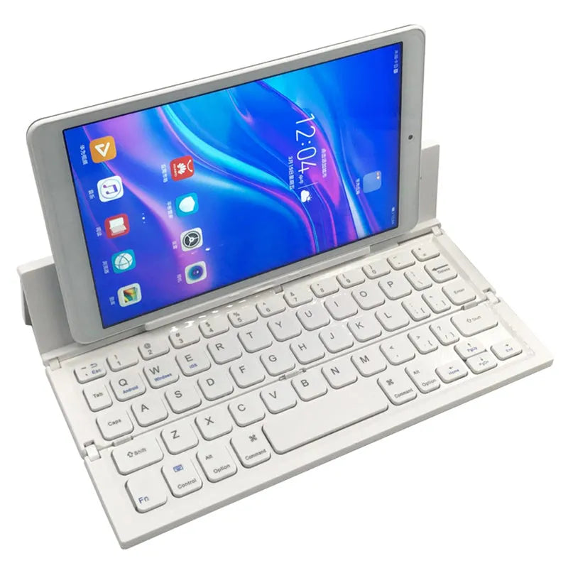 Black and white views of a folded mini wireless Bluetooth keyboard for tablets next to a smartphone.