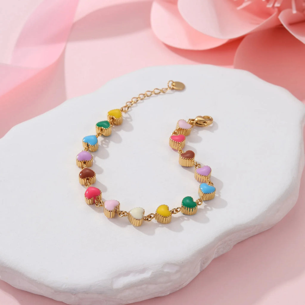 Women's titanium steel bracelet with oil-filled heart pendant in gold or steel finish
