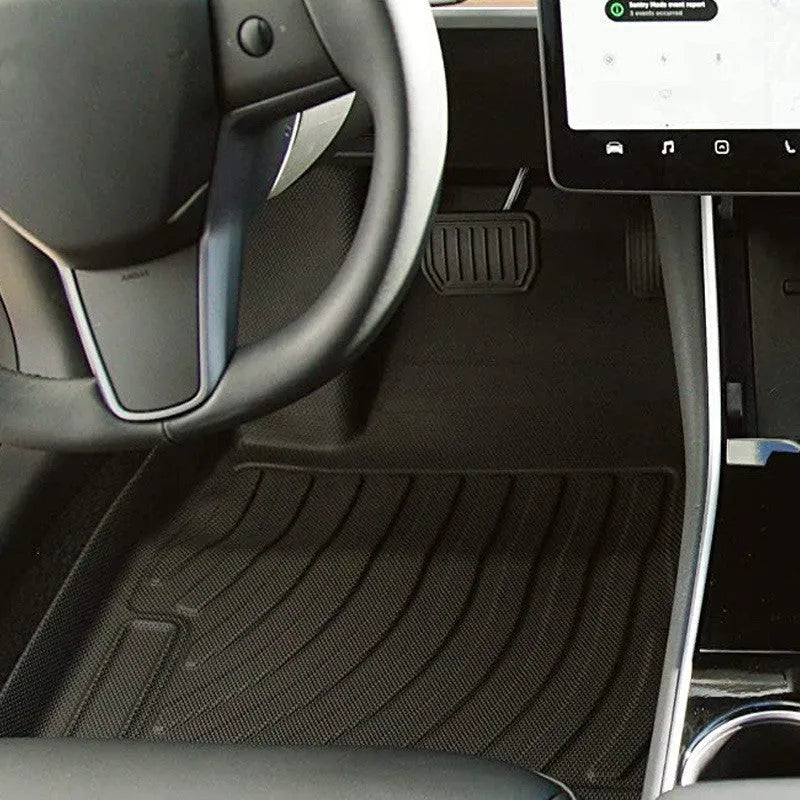 Set of black rubber floor mats for a Tesla car interior