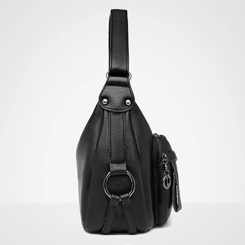Blue women's large shoulder bag with crossbody strap showing internal mobile phone and certificate pockets
