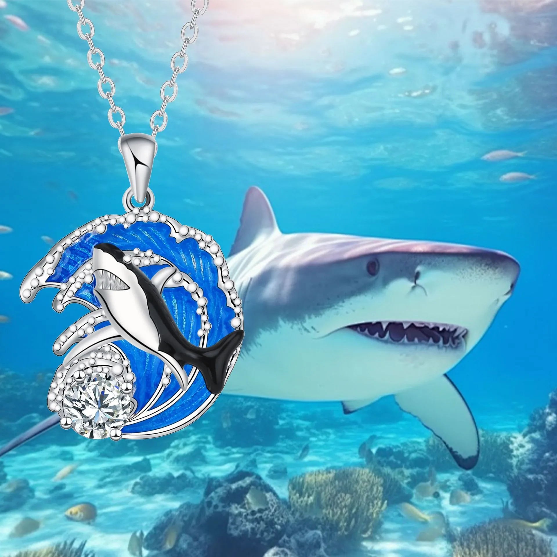 Women's silver-tone necklace with a detailed shark pendant on a cross chain.