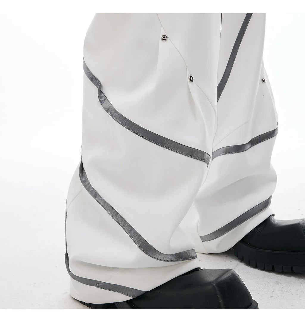 Men's trousers with three-dimensional cutting and metal striped rivet pleated details