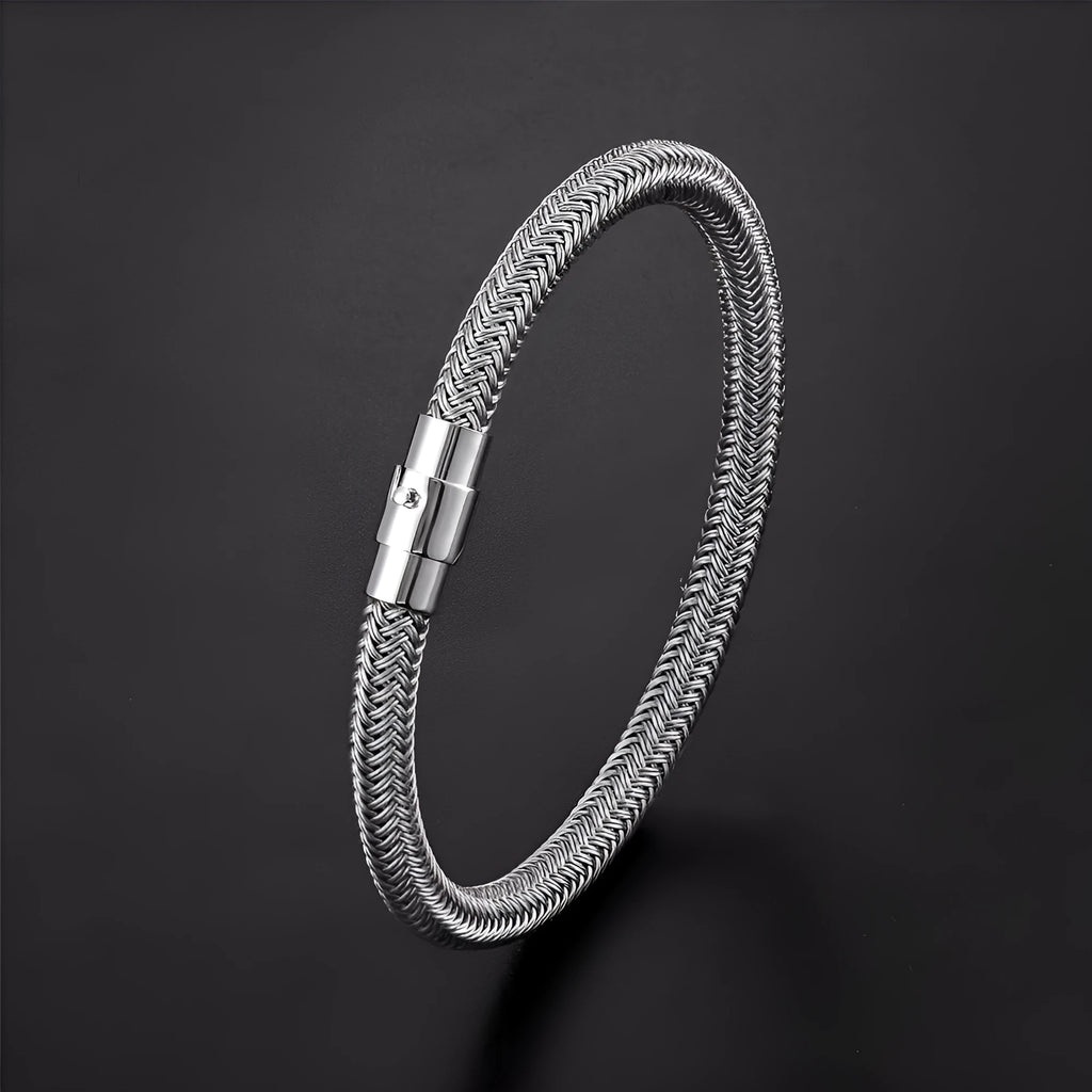 Titanium steel geometric wire bracelet with magnet socket closure in silver tone.