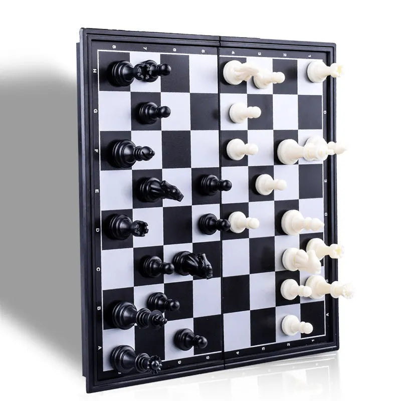 Three-in-one magnetic chess checkers backgammon board game with plastic board and ABS pieces on a table