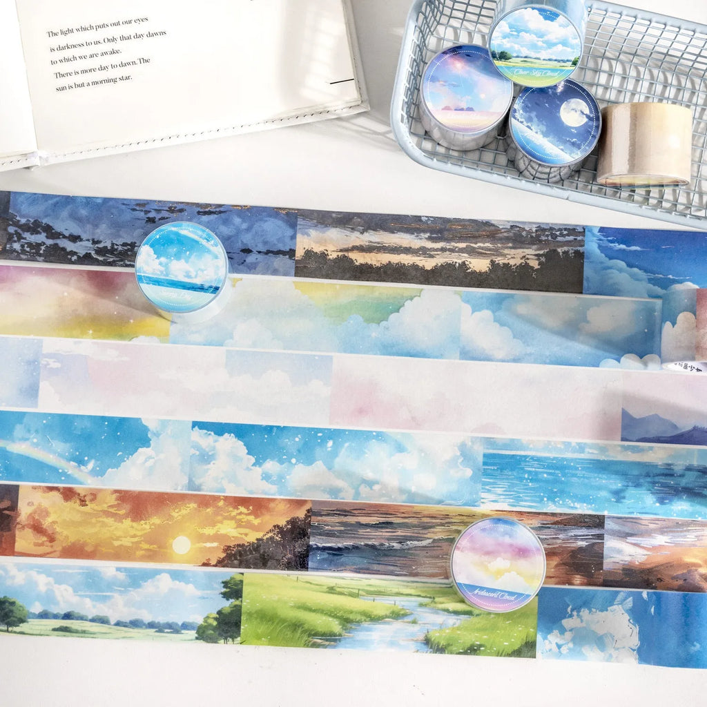 Roll of Japanese paper decorative washi tape with sky theme designs, showing colourful clouds, sunny day, and twilight patterns.