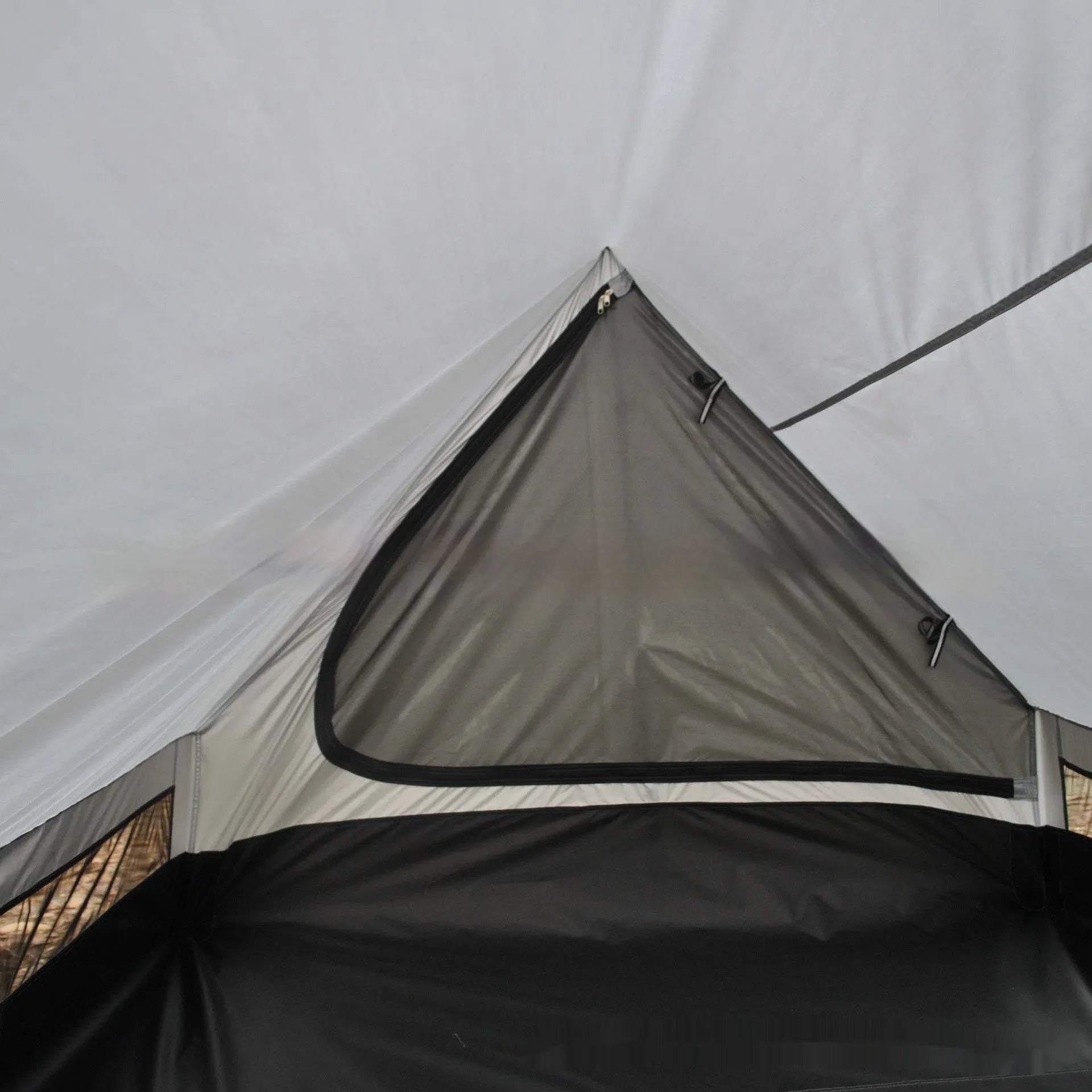 Brown A-line trekking tent pitched using hiking poles with dimensions 210x150x110cm